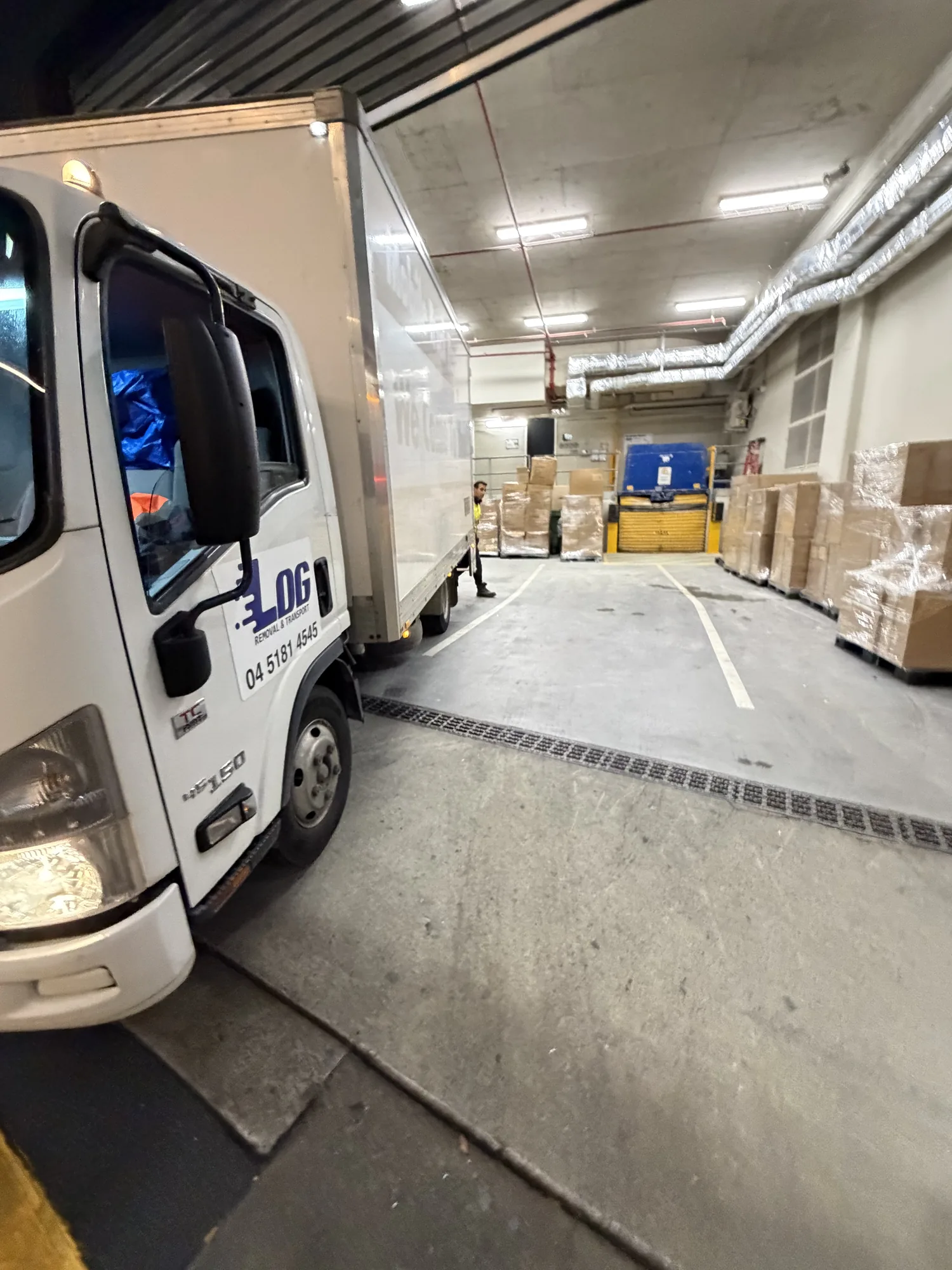 LOG Transport removalist truck at a Brisbane office loading dock